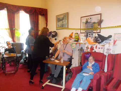female carer and resident waltzing to the music